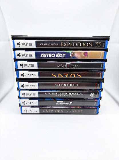 Two matching black holders stacked horizontally with eight PS5 game cases, four per holder.