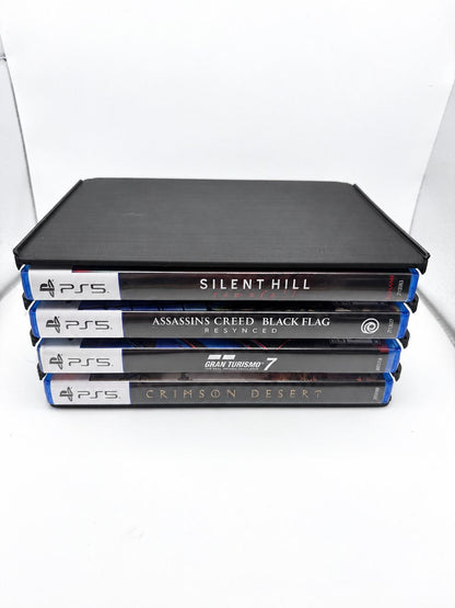 One black four-slot holder with four PS5 cases stored horizontally, spines facing forward.